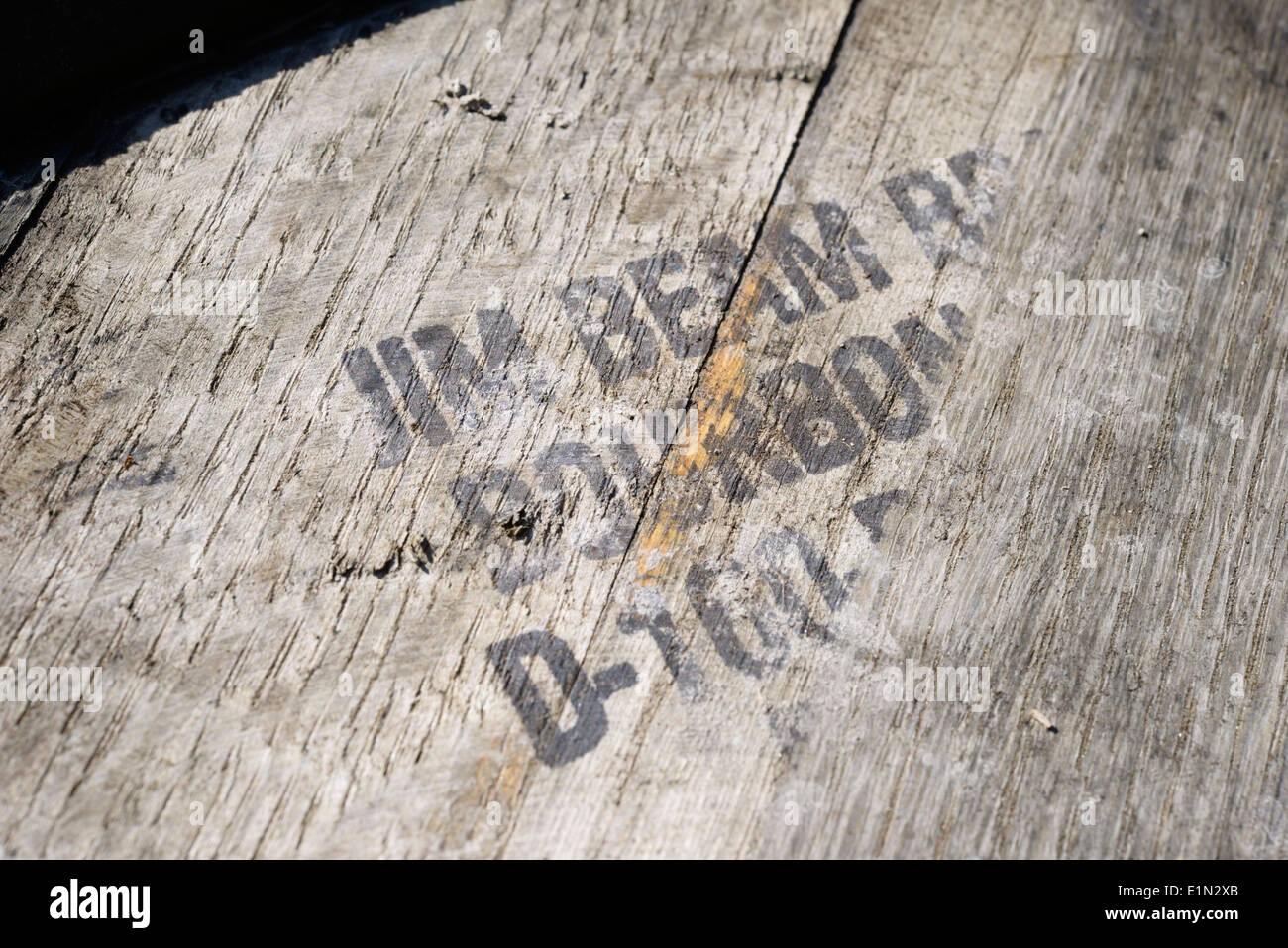 Stencilled text on an old Whisky barrel - Jim Beam Bourbon. Stock Photo