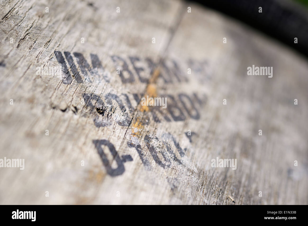 Stencilled text on an old Whisky barrel - Jim Beam Bourbon. Stock Photo