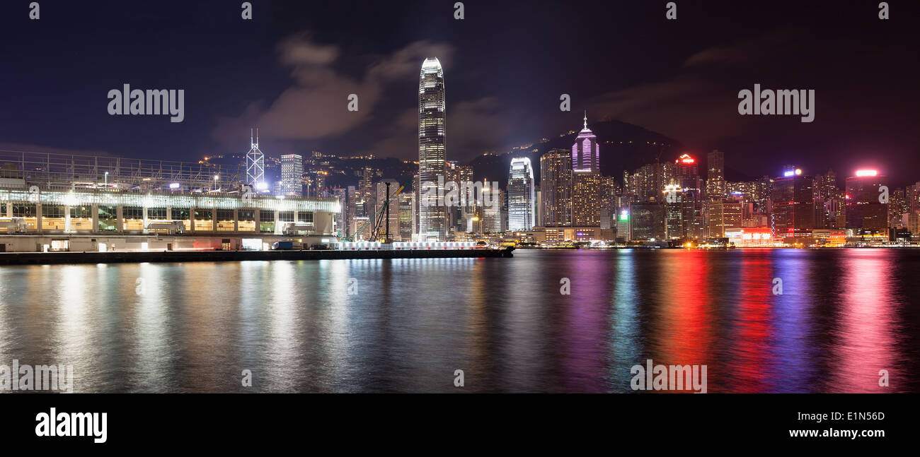 Ocean Terminal at Tsim Sha Tsui with Hong Kong Central Island City Skyline at Night Panorama Stock Photo