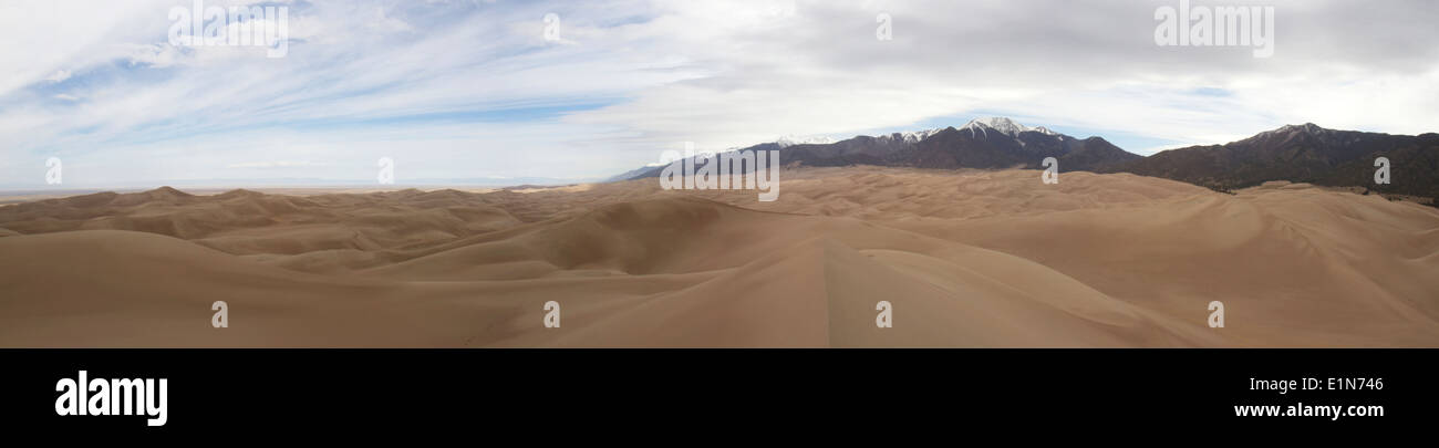 Panoramic vista of Great Sand Dunes and Preserve with Sangre de Cristo Mountains Stock Photo
