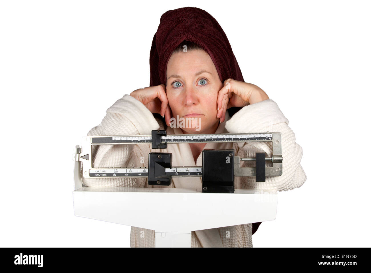 https://c8.alamy.com/comp/E1N75D/mature-woman-in-bathrobe-standing-on-a-bathroom-scale-looking-perplexed-E1N75D.jpg