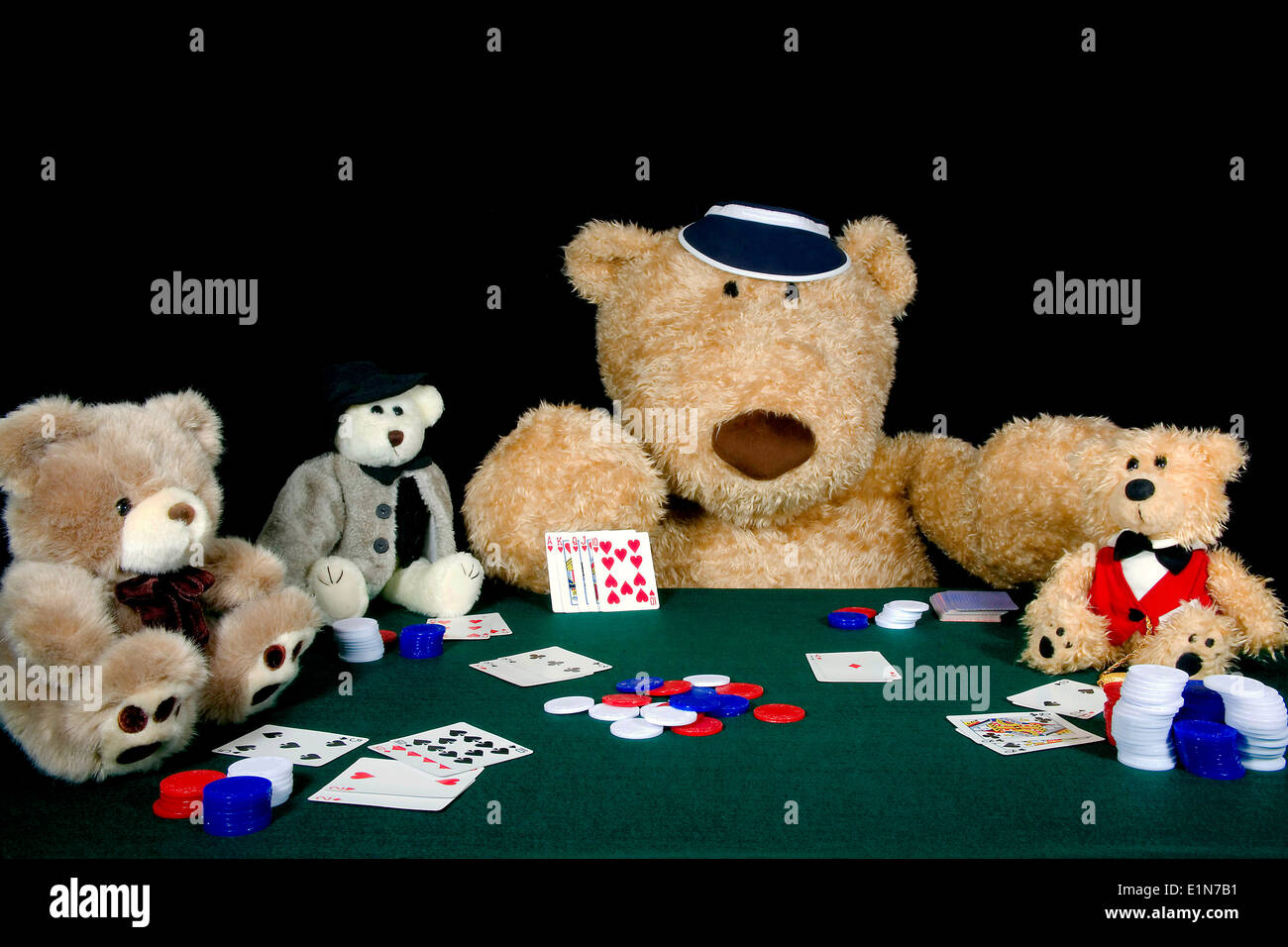 Group of teddy bears playing a friendly game of poker. Stock Photo
