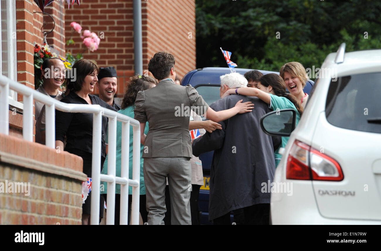 Hove Brighton Sussex UK 7 June 2014 - War veteran 89 year old Bernard Jordan returns home to be welcomed by staff at The Pines Nursing Home in Hove after he had disappeared to Normandy France to see the D-Day celebrations Bernard was reported missing by the home but it turned out he had taken himself off to France to be with other veterans Credit:  Simon Dack/Alamy Live News Stock Photo