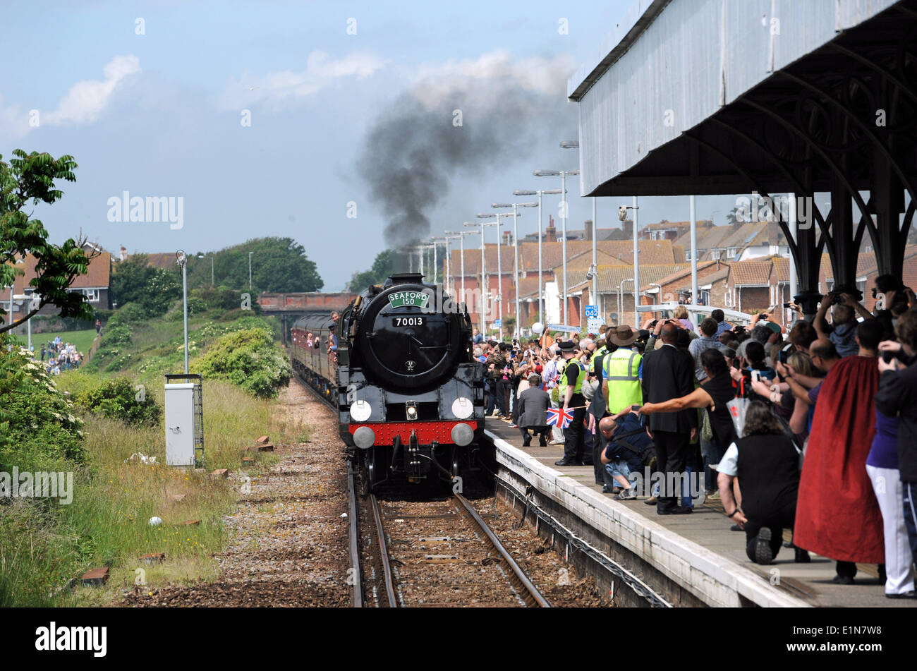Seaford Sussex UK 7 June - The Oliver Cromwell a Britannia class 'Pacific' steam locomotive pulls into Seaford station Stock Photo