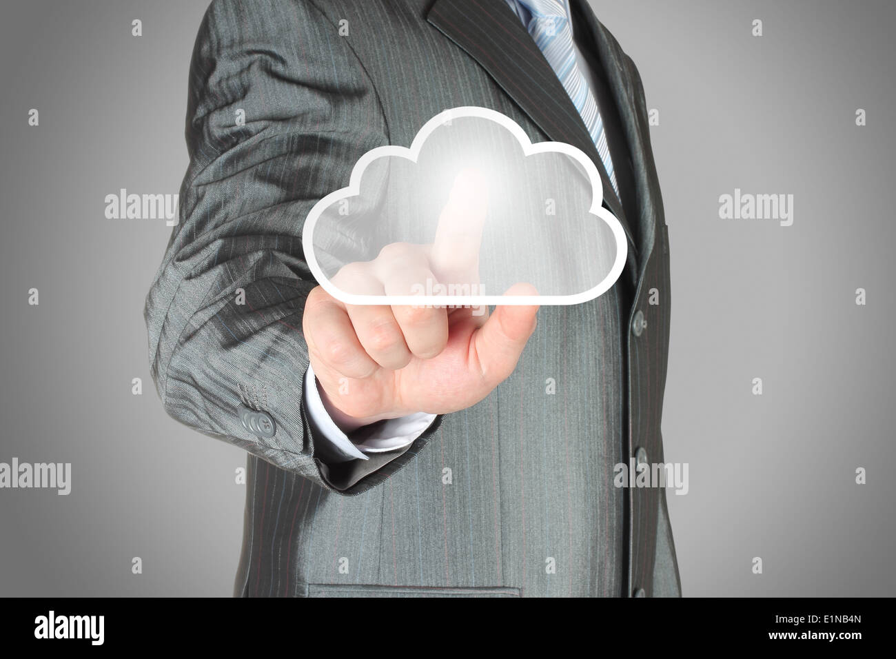 Businessman pushes virtual cloud button. Cloud computing concept Stock Photo