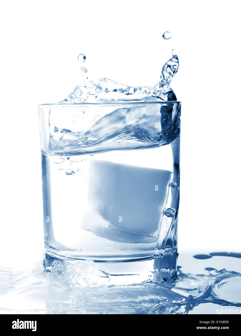 Ice in glass of water with splash on white background Stock Photo - Alamy