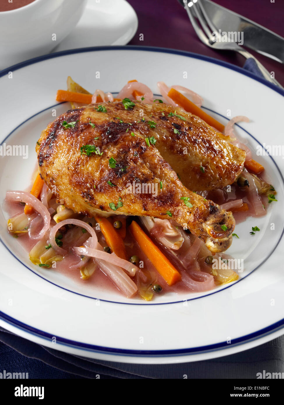 Port and green peppercorn crispy chicken main meal individual portion Stock Photo
