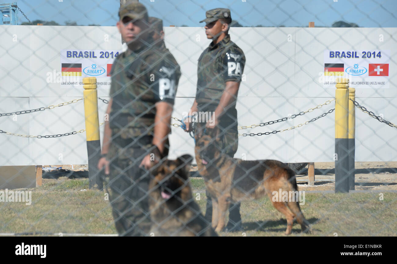 Porto Seguro, Brazil. 07th June, 2014. Soldiers with dogs stand at an entrance of the airport in Porto Seguro, Brazil, 07 June 2014. The FIFA World Cup will take place in Brazil from 12 June to 13 July 2014. Photo: Marcus Brandt/dpa/Alamy Live News Stock Photo