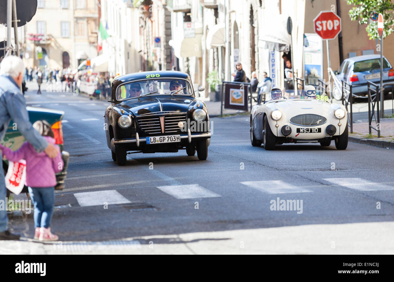 A 1954 Goliath GP 700 passing an Austin Healy S100 from 1955 during the 2014 mille miglia classic car rally Stock Photo