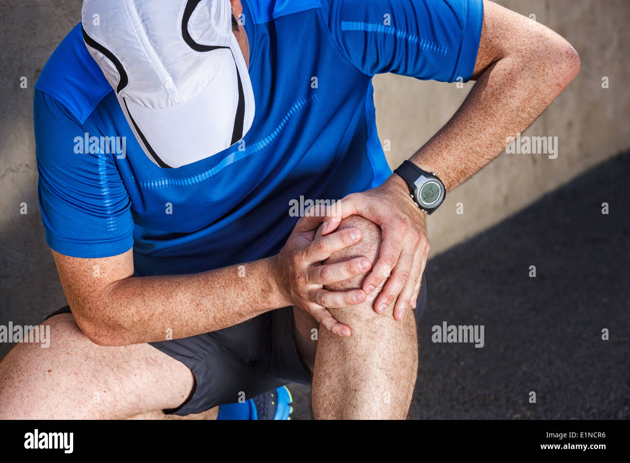 Male runner having problems in knee joint Stock Photo Alamy