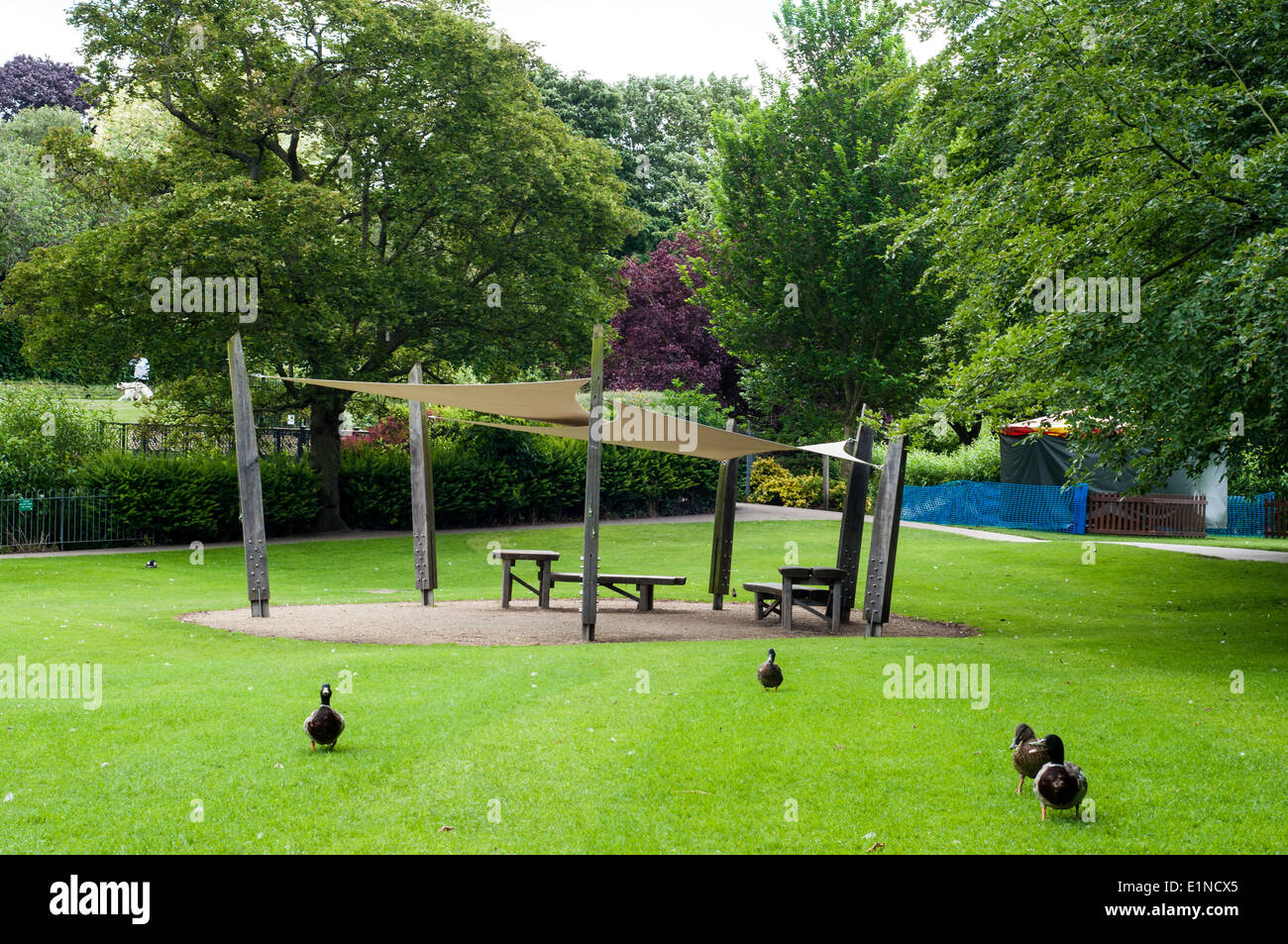 Covered resting area in a Park with ducks, Abbey garden Bury ST Edmund, Suffolk, UK Stock Photo