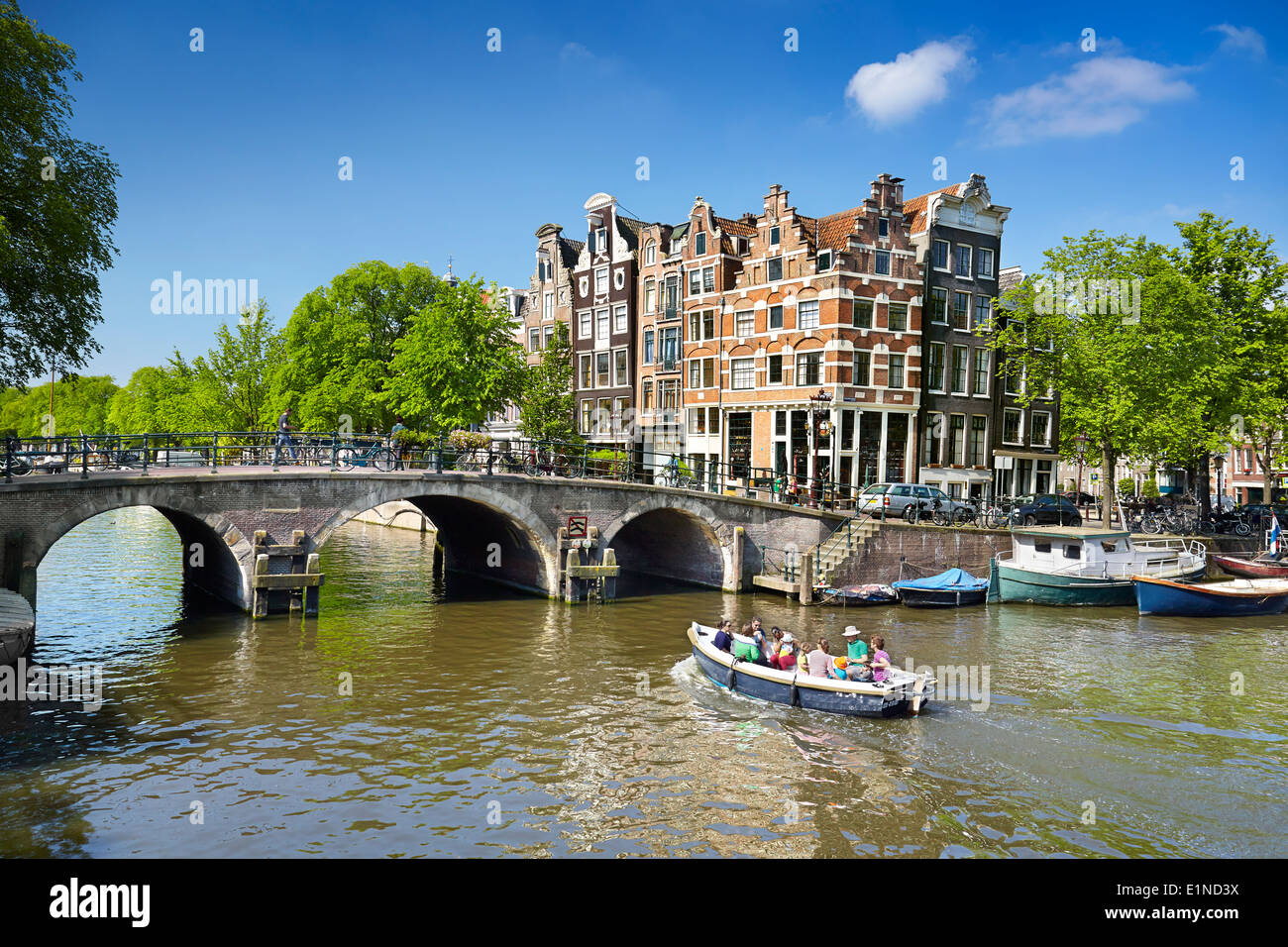 Tourist boat on the Amsterdam canal - Holland Netherlands Stock Photo