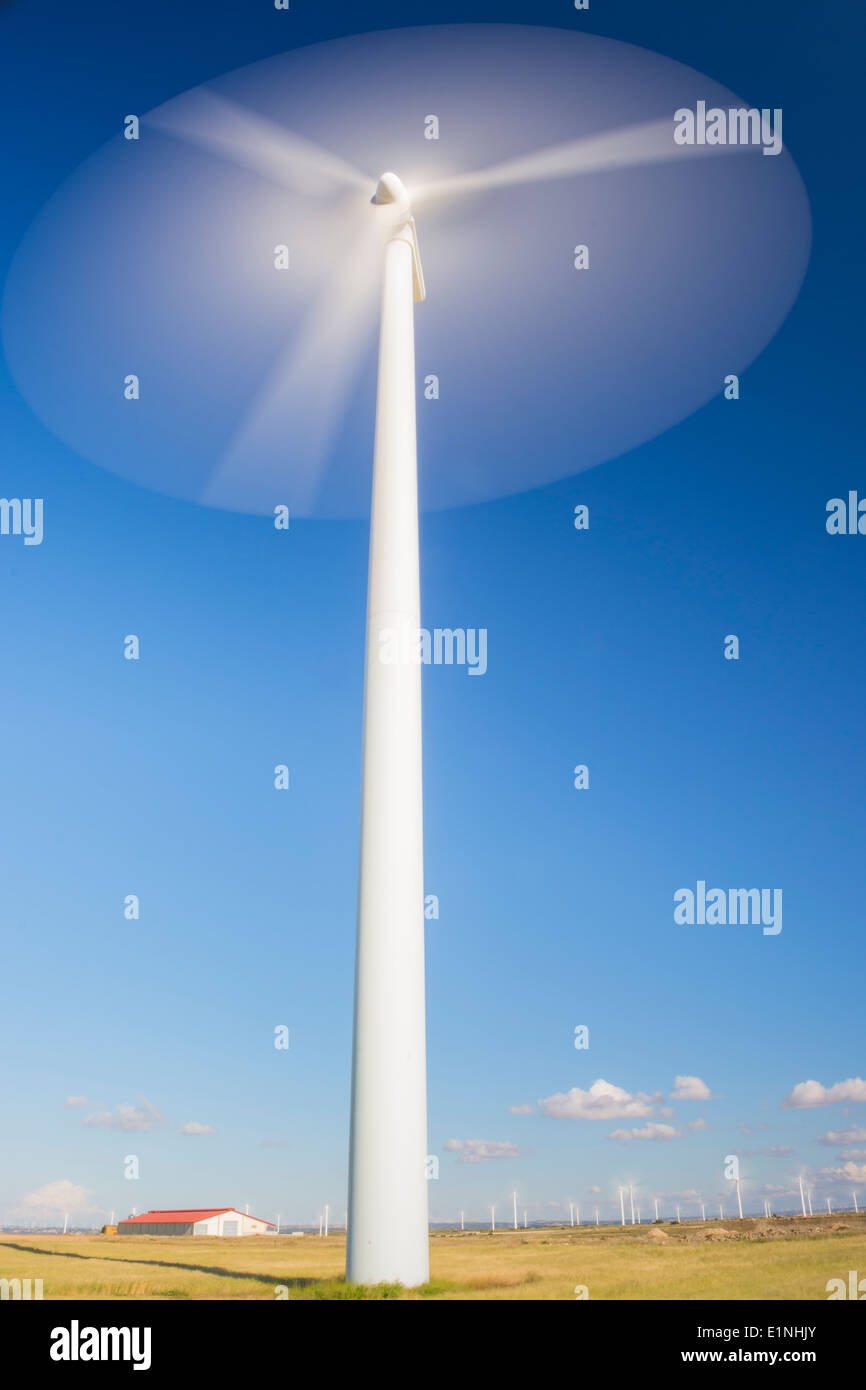 Wind turbine with a blue sky in the background Stock Photo - Alamy