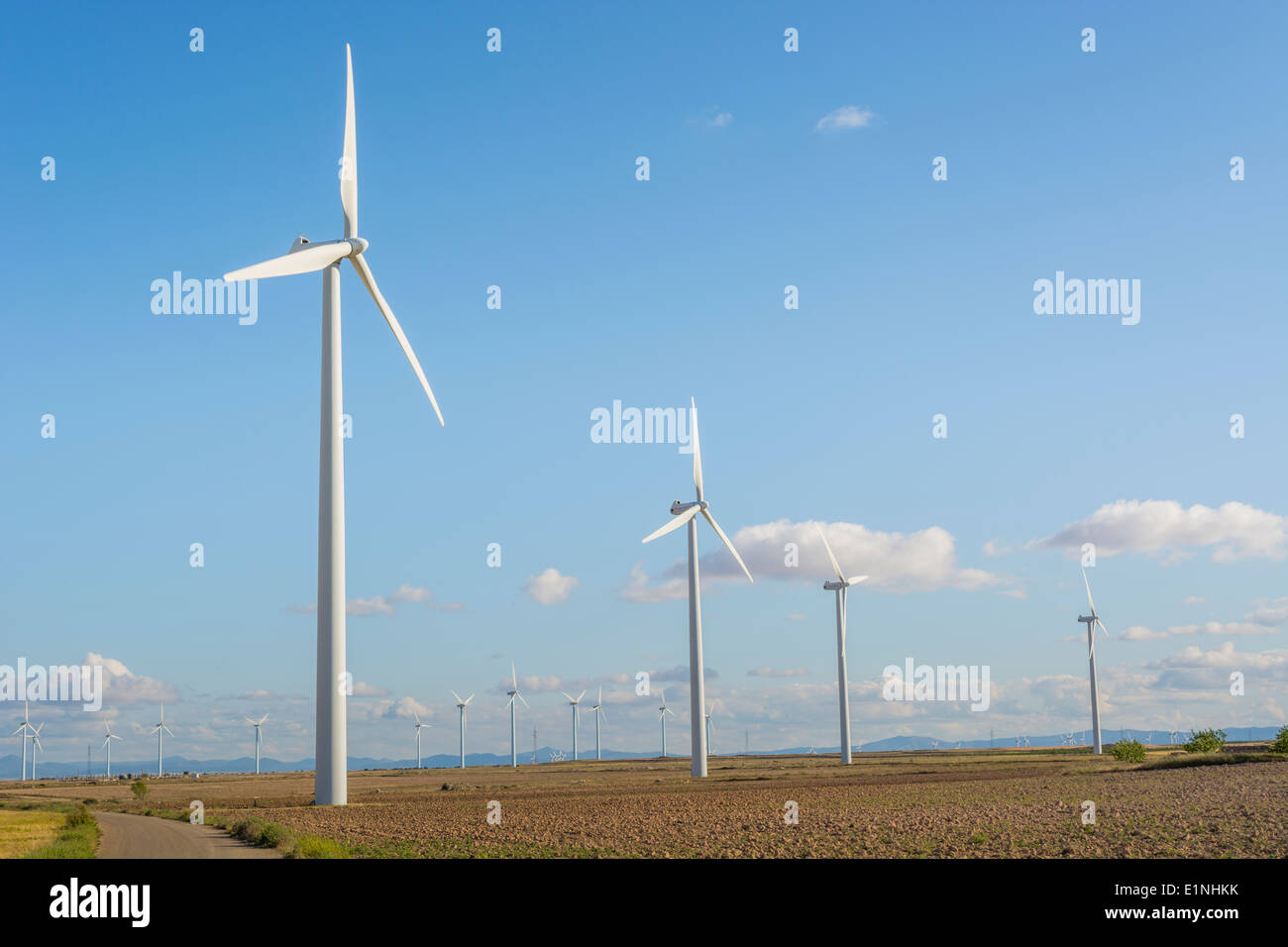 Wind turbine with a blue sky in the background Stock Photo - Alamy