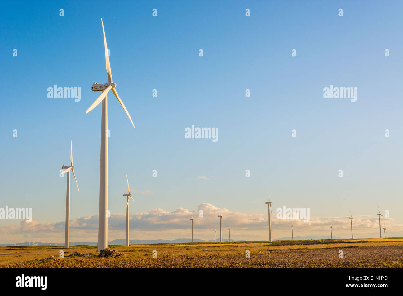 Wind turbine with a blue sky in the background Stock Photo - Alamy