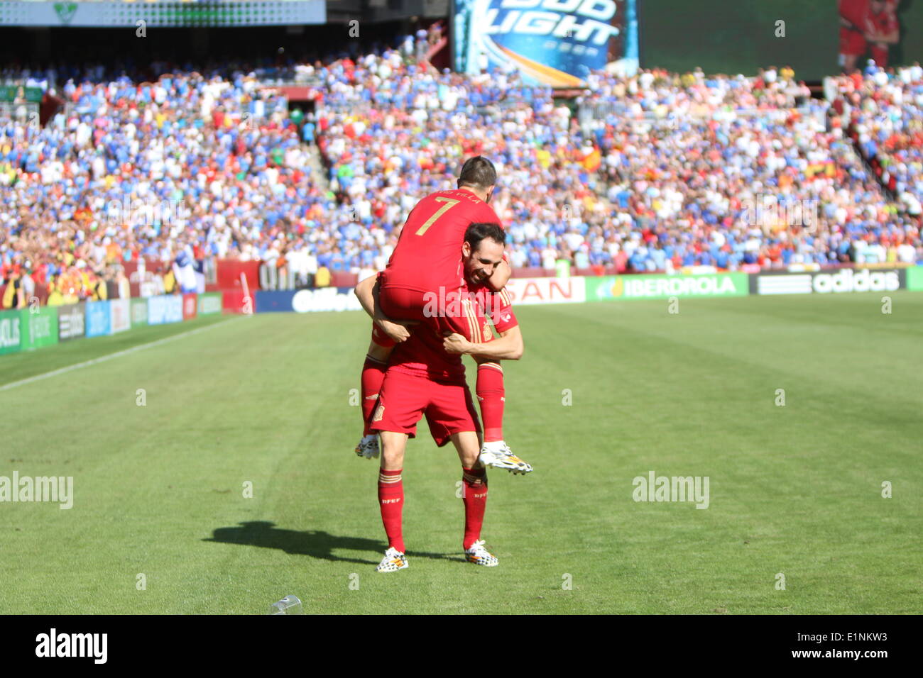 Washington, D.C, USA. 07th June, 2014. World Cup Soccer Warm up between Spain and El Salvador. Spain win 2-0, Goals by Spain # 7 David Villa.David Villa is pickup by teammate after scoring. Credit:  Khamp Sykhammountry/Alamy Live News Stock Photo