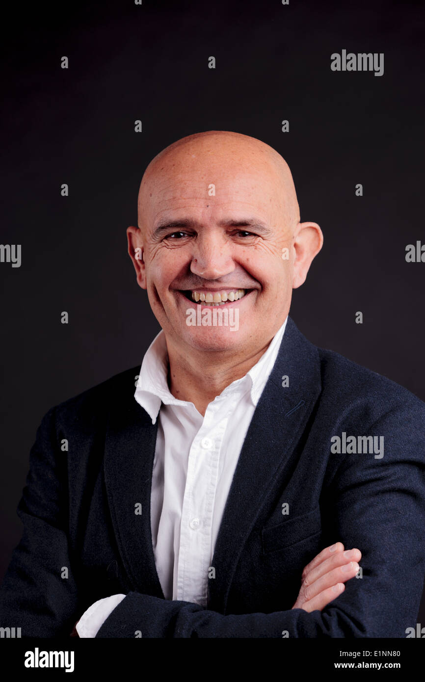 old bald self-confident businessman on a dark background Stock Photo