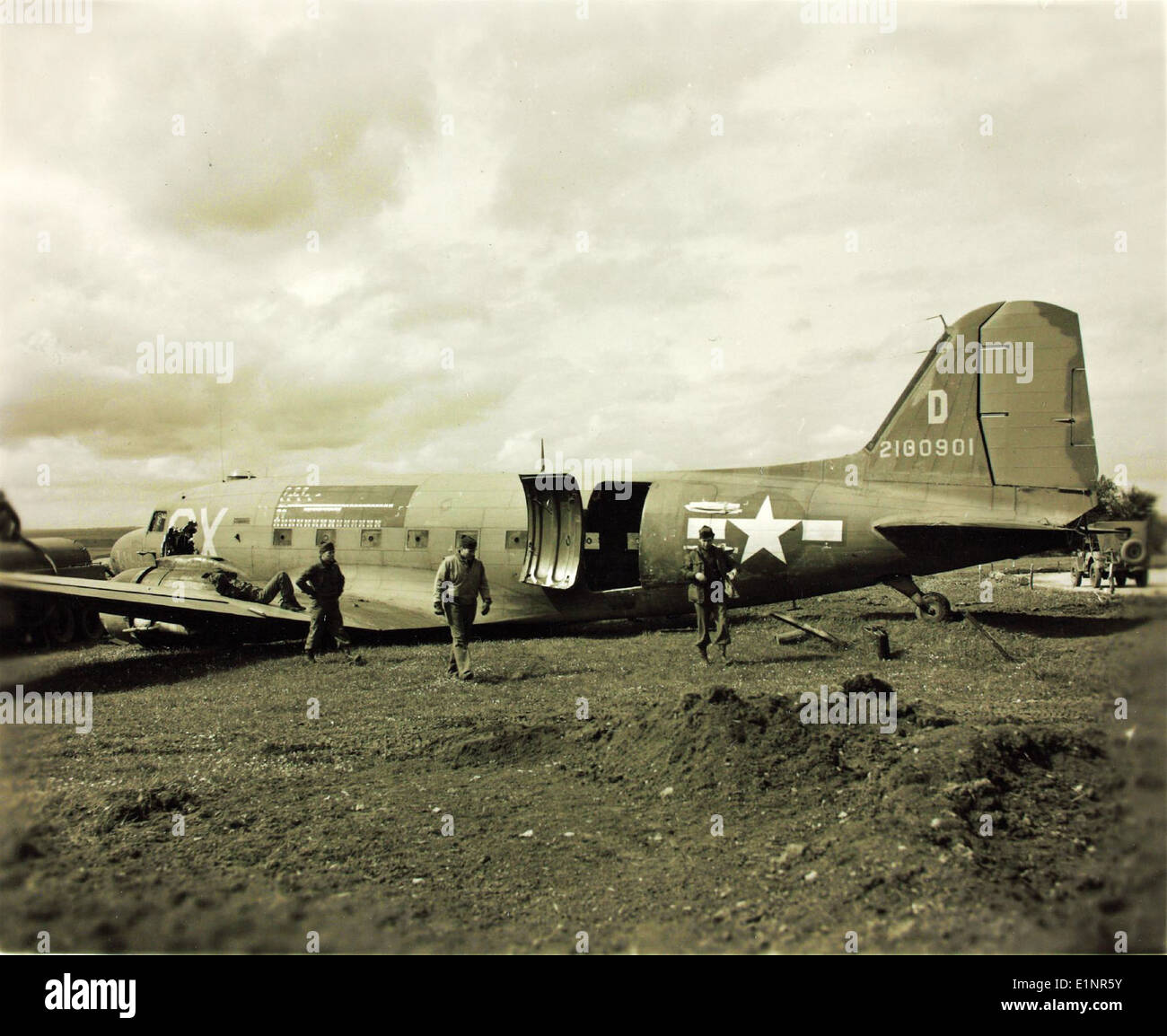 This image documents an aircraft accident involving a Douglas C-47 (42-100901) during the 1940s. The C-47 was a military transport aircraft used extensively during World War II and after. Stock Photo