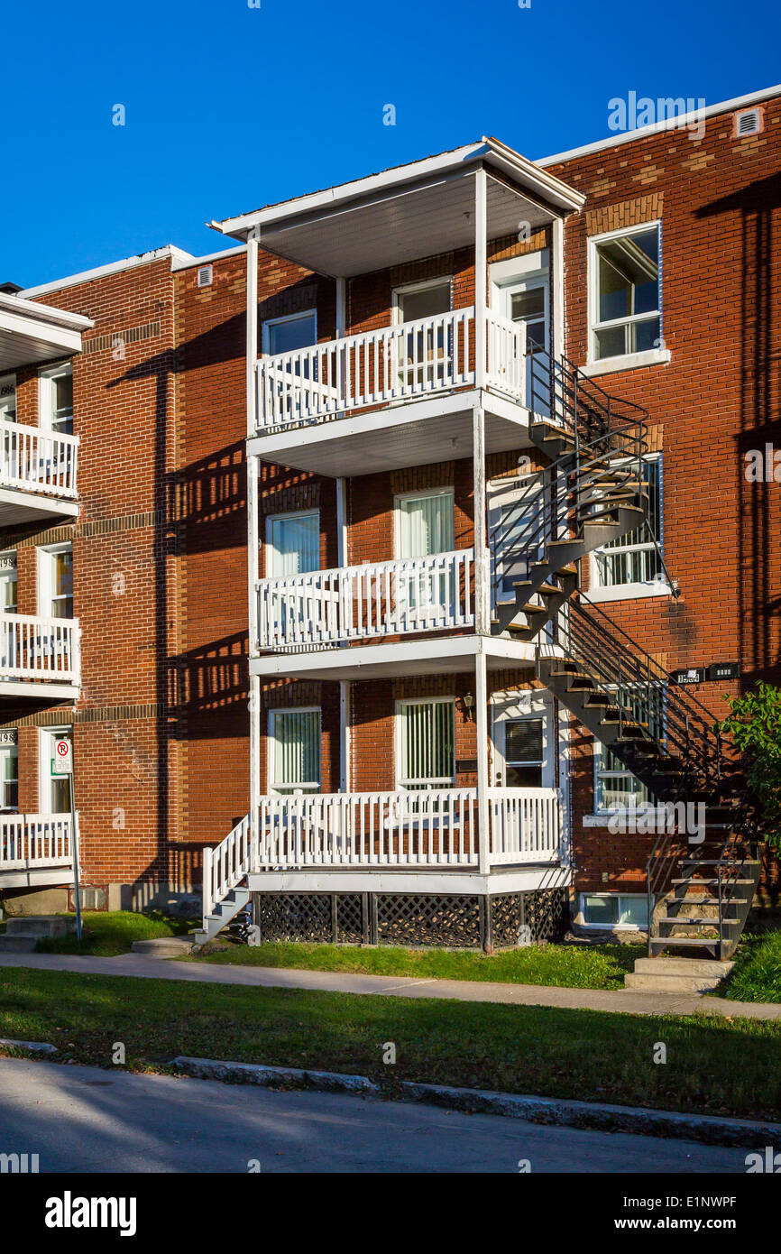 Three story apartment blocks on a street in Shawinigan, Quebec, Canada. Stock Photo