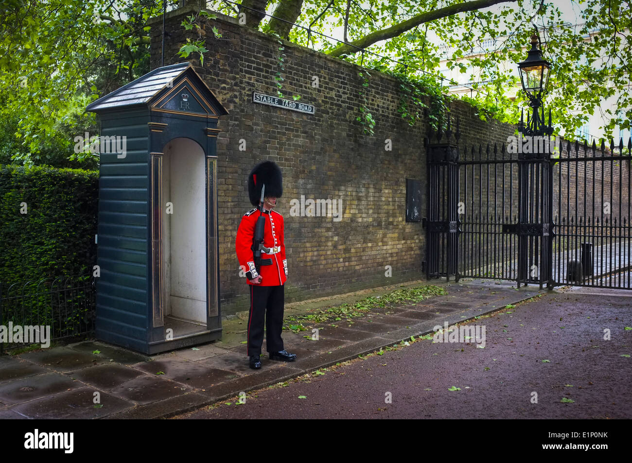 Sentry in traditional costume standing guard at Clarence House in London Stock Photo