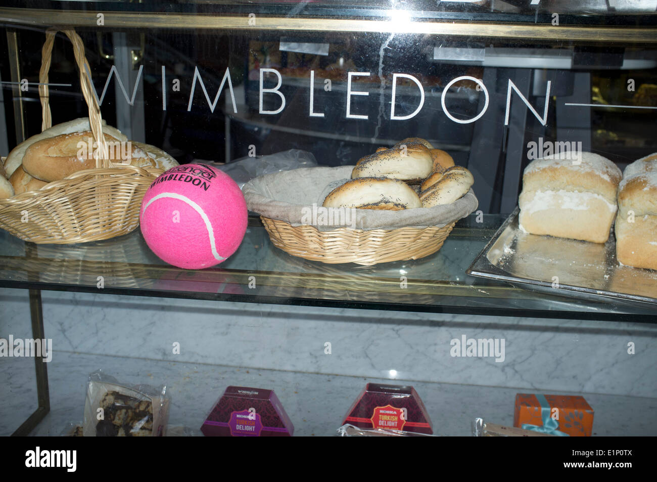 Wimbledon, London, UK. 08th June, 2014. A pink tennis ball displayed in the window of a bakery ahead of the 2014 Lawn tennis championships Credit:  amer ghazzal/Alamy Live News Stock Photo