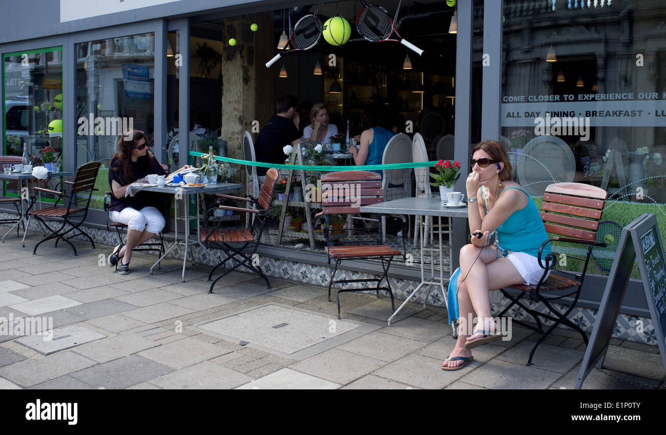 Wimbledon, London, UK. 08th June, 2014. Shops and restaurant windows are decorated with rackets and tennis balls ahead of the 2014 Lawn tennis championships Credit:  amer ghazzal/Alamy Live News Stock Photo