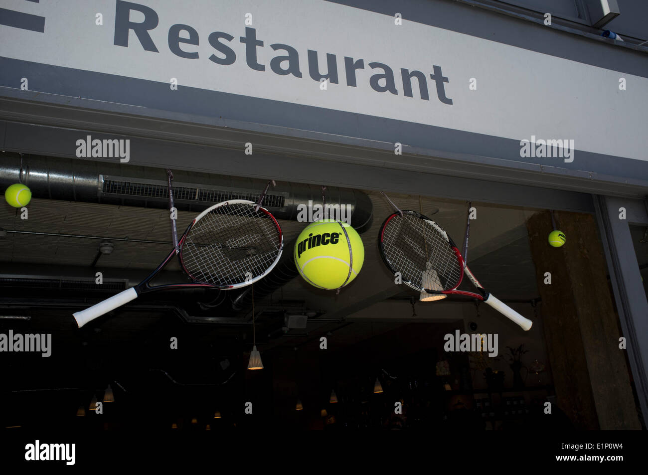 Wimbledon, London, UK. 08th June, 2014. Shops and restaurants are decorated with rackets and tennis balls ahead of the 2014 Lawn tennis championships Credit:  amer ghazzal/Alamy Live News Stock Photo