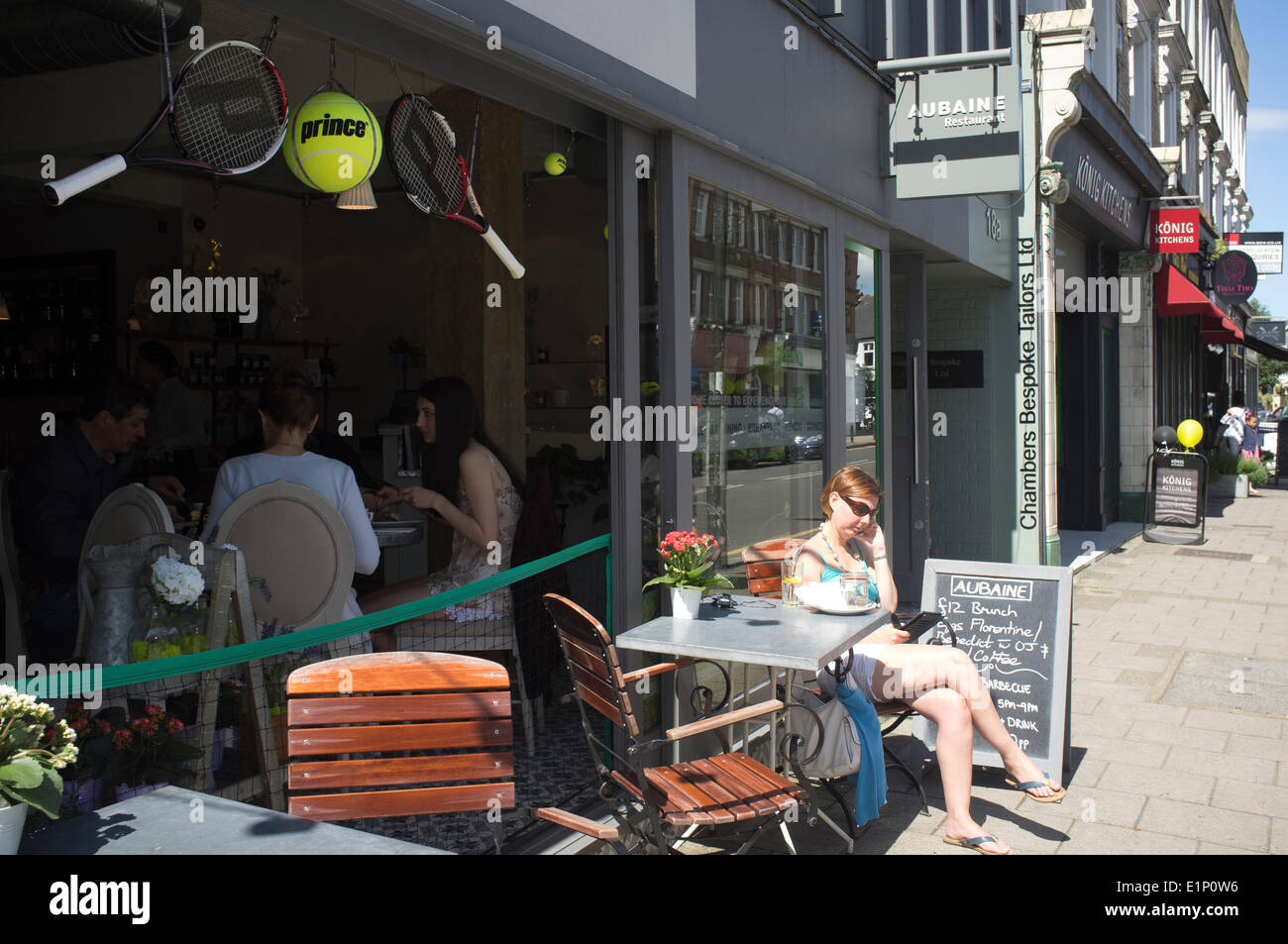 Wimbledon, London, UK. 08th June, 2014. Shops and restaurants are decorated with rackets and tennis balls ahead of the 2014 Lawn tennis championships Credit:  amer ghazzal/Alamy Live News Stock Photo