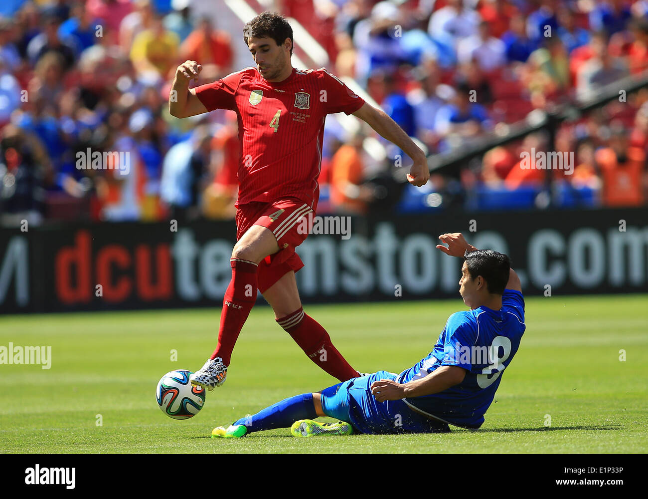 Landover, Maryland, USA. 07th June, 2014. Javi Martinez (4) of Spain gets the ball away from Kevin Santamaria (8) of El Salvador during an international friendly match at Fedex Field, in Landover, Maryland. Spain won 2-0. Credit:  Action Plus Sports/Alamy Live News Stock Photo