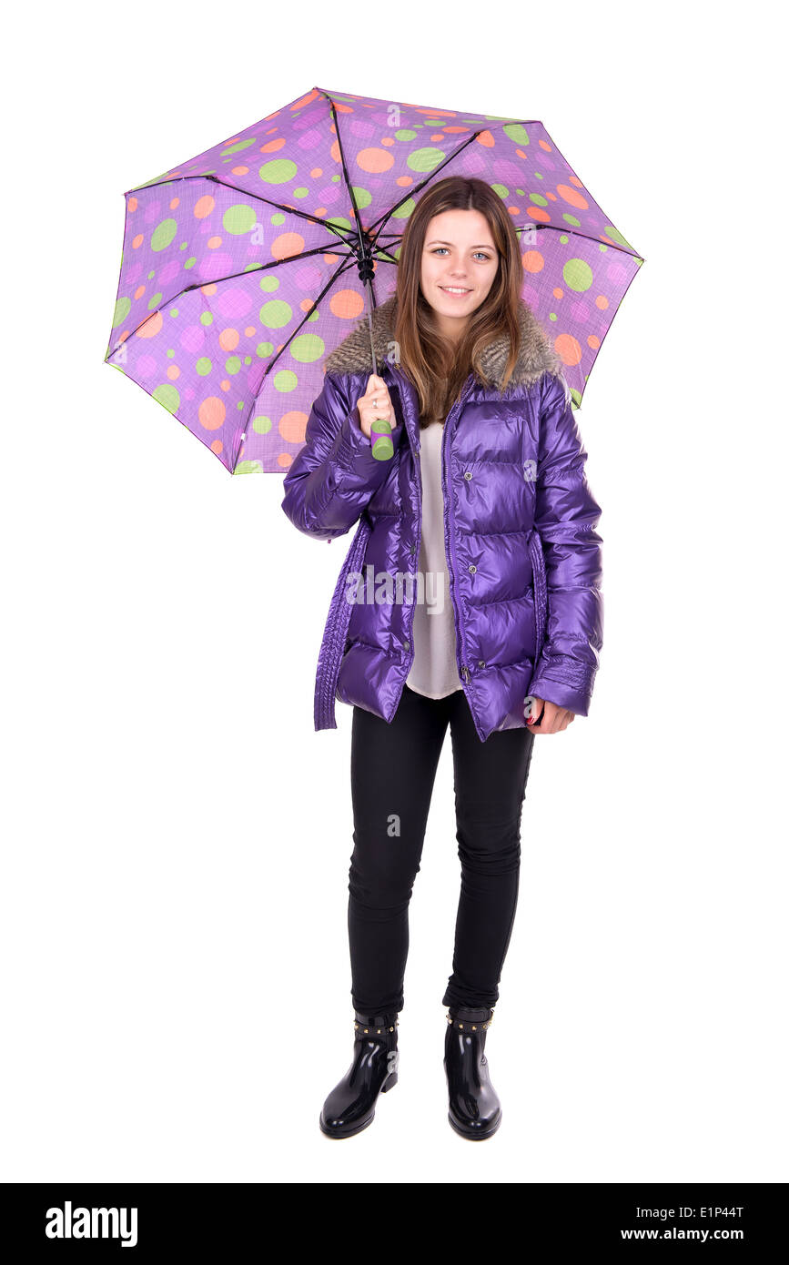 Beautiful young woman posing with an umbrella isolated in white Stock Photo