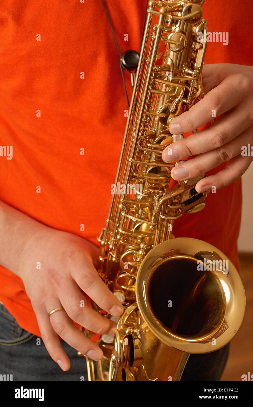 Playing the saxophone at home Stock Photo