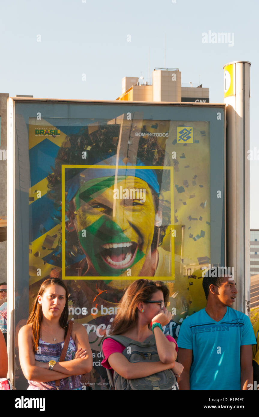 Brazilian commuters in front of advertising Stock Photo