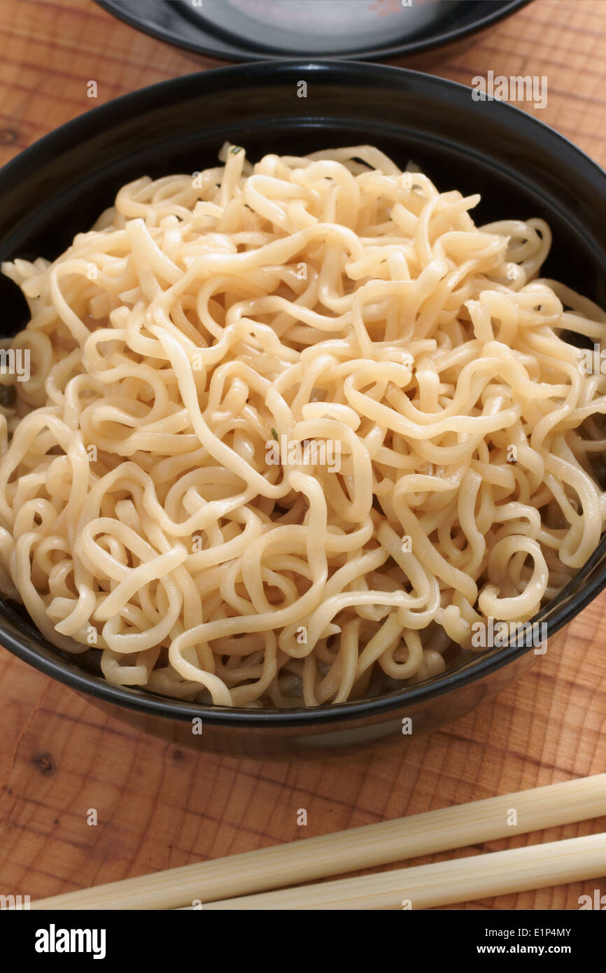 Ramen instant noodles in lacquer bowls with chopsticks Stock Photo