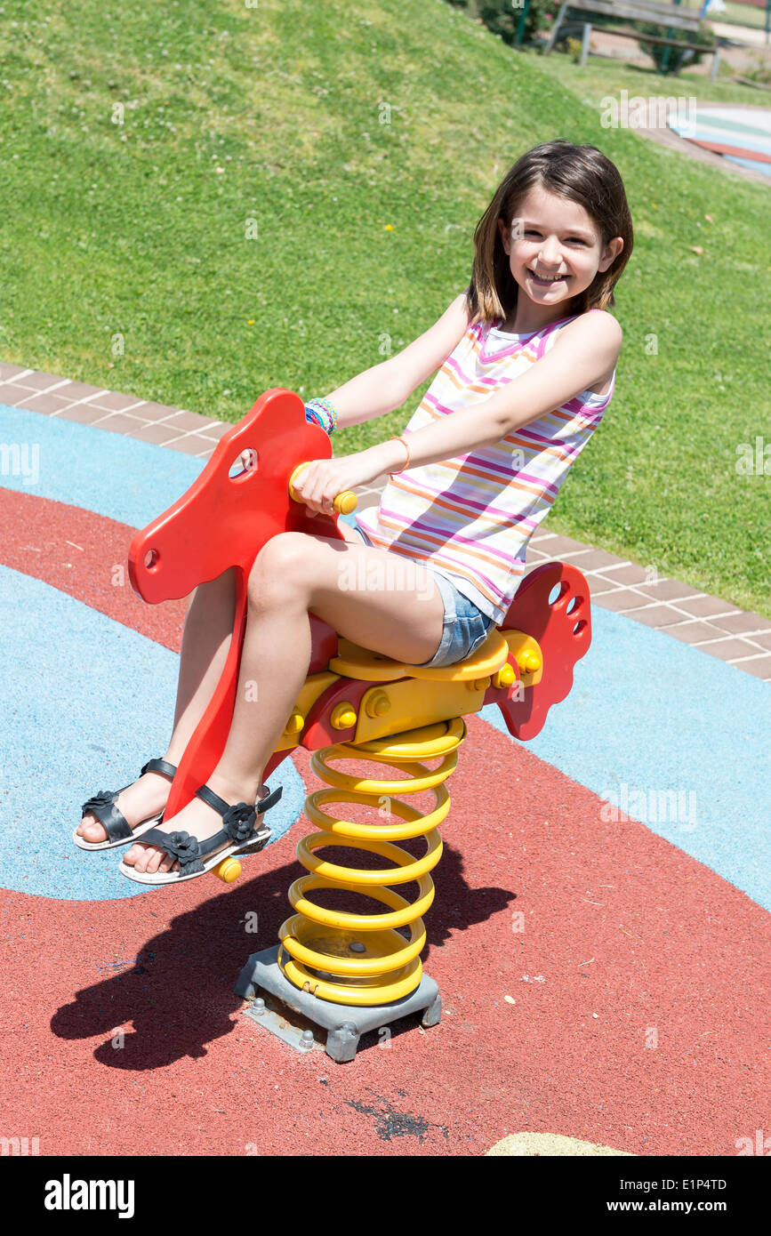 Young girl playing in the park Stock Photo Alamy