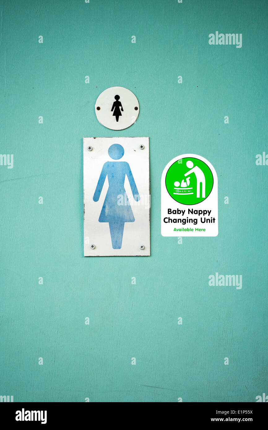 Ladies toilet sign on door with nappy changing facility sticker Stock