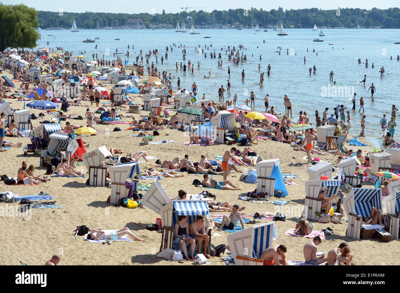 Berlin, Germany. 7th June, 2014. Sunbathers enjoy the hot and summery weather on a Wannsee lido in Berlin, Germany, 7 June 2014. Photo: Rainer Jensen/dpa/Alamy Live News Stock Photo
