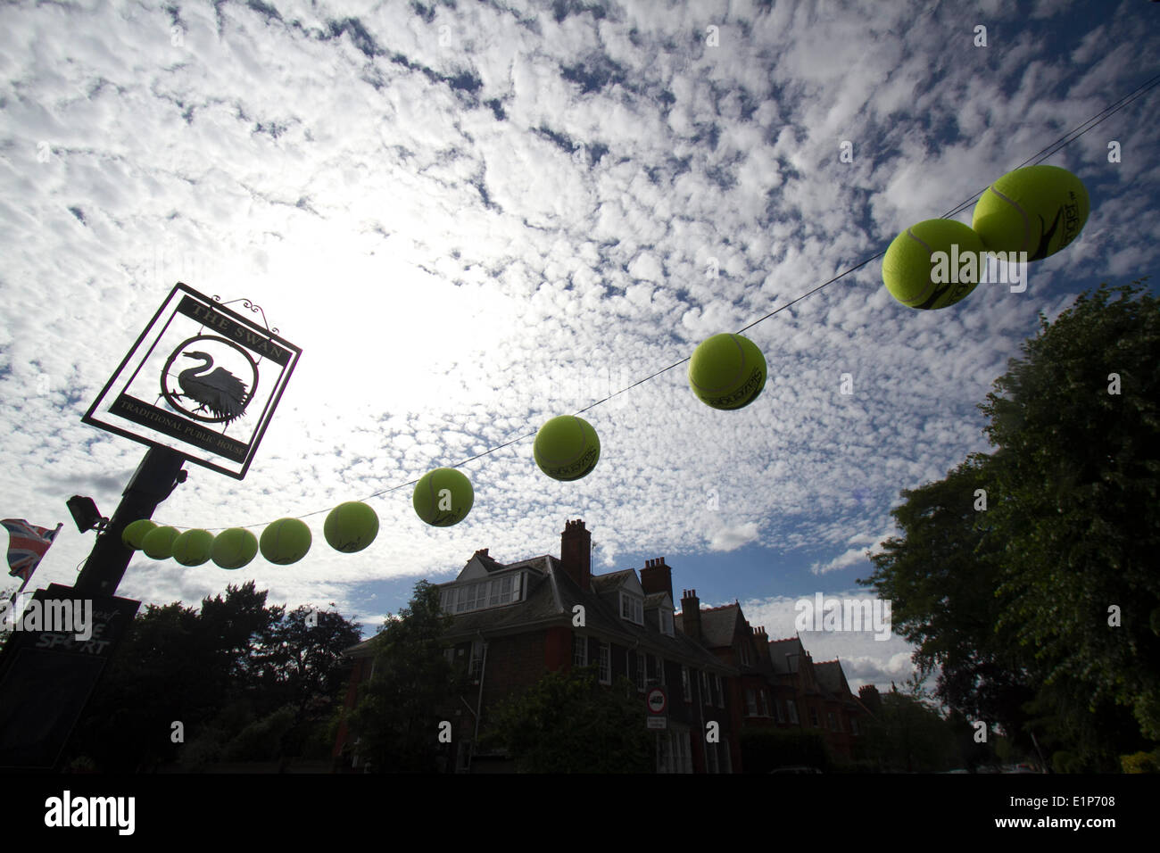 Wimbledon London, 8th June 2014. The Swan pub in Wimbledon flies tennis balls ahead of the 2014 Wimbledon lawn tennis championships which start on 23rd June Credit:  amer ghazzal/Alamy Live News Stock Photo