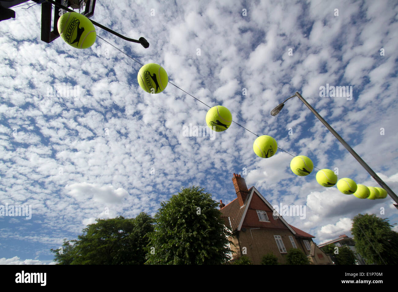 Wimbledon London, 8th June 2014. The Swan pub in Wimbledon flies tennis balls ahead of the 2014 Wimbledon lawn tennis championships which start on 23rd June Credit:  amer ghazzal/Alamy Live News Stock Photo