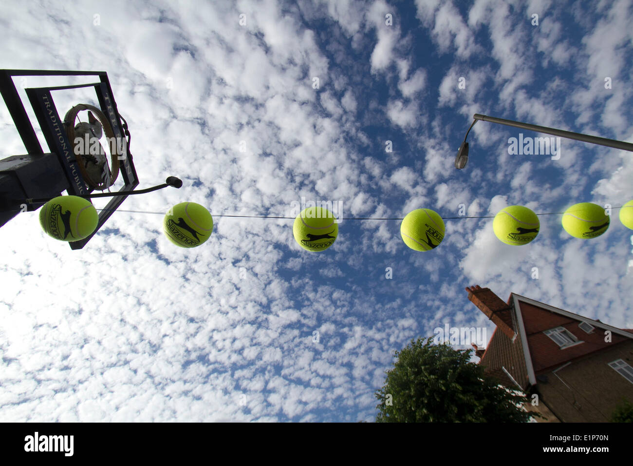 Wimbledon London, 8th June 2014. The Swan pub in Wimbledon flies tennis balls ahead of the 2014 Wimbledon lawn tennis championships which start on 23rd June Credit:  amer ghazzal/Alamy Live News Stock Photo