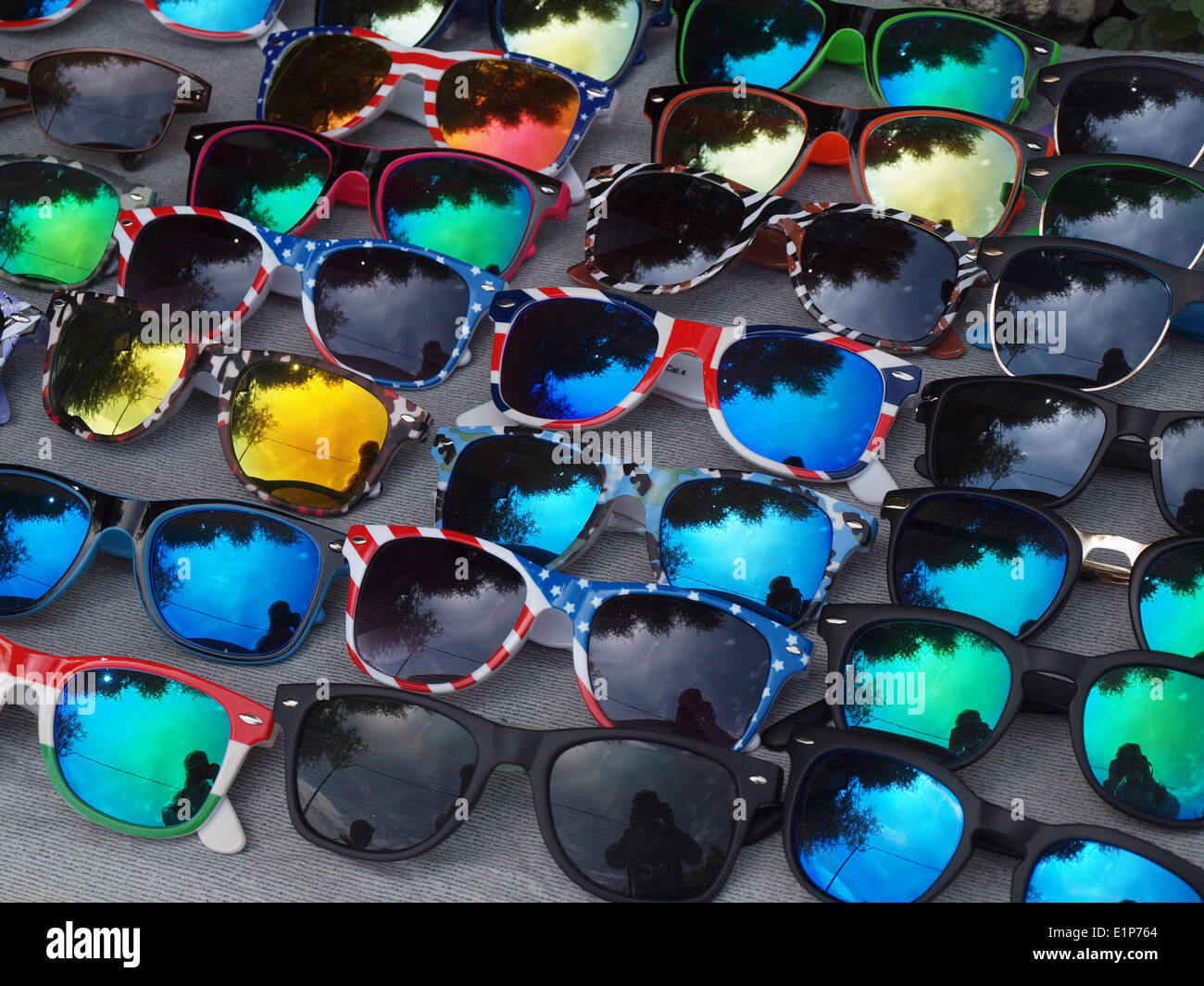 Rows of many colourful sunglasses on sale in street of Taormina