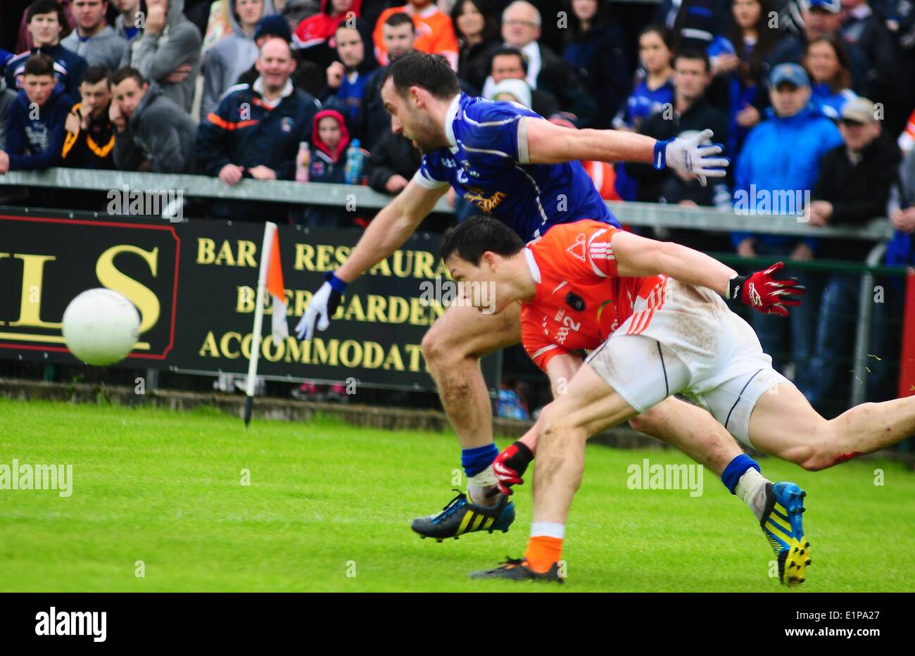 James Morgan and Eugene Keating race for the ball.  Armagh 1-12 Cavan 0-09 Athletic Grounds, Armagh, Co.Armagh  8 June 2014 Credit: LiamMcArdle.com/Alamy Live News Stock Photo