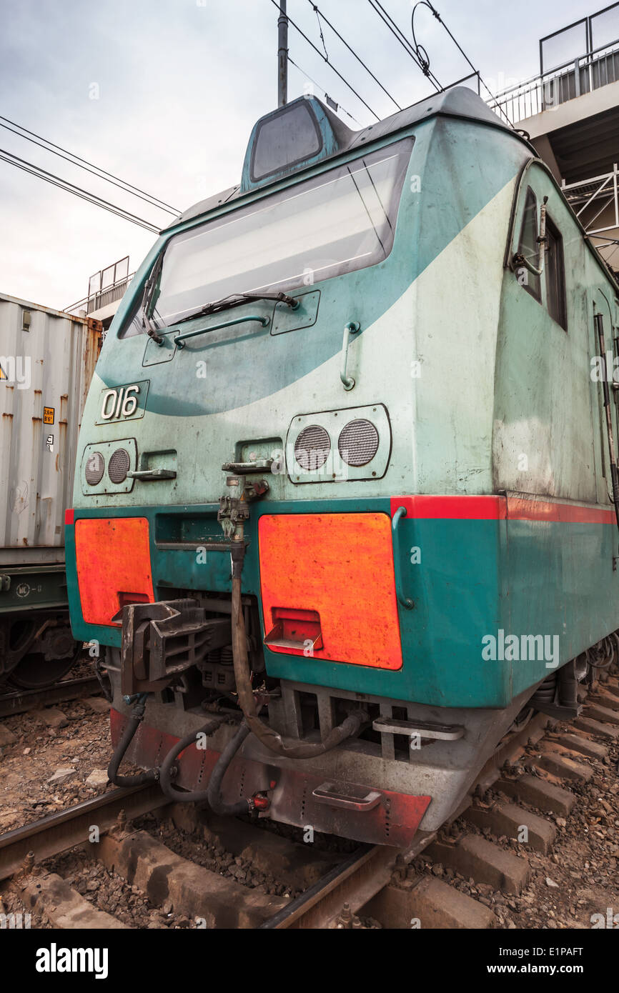 Modern green cargo train locomotive with red signs Stock Photo - Alamy