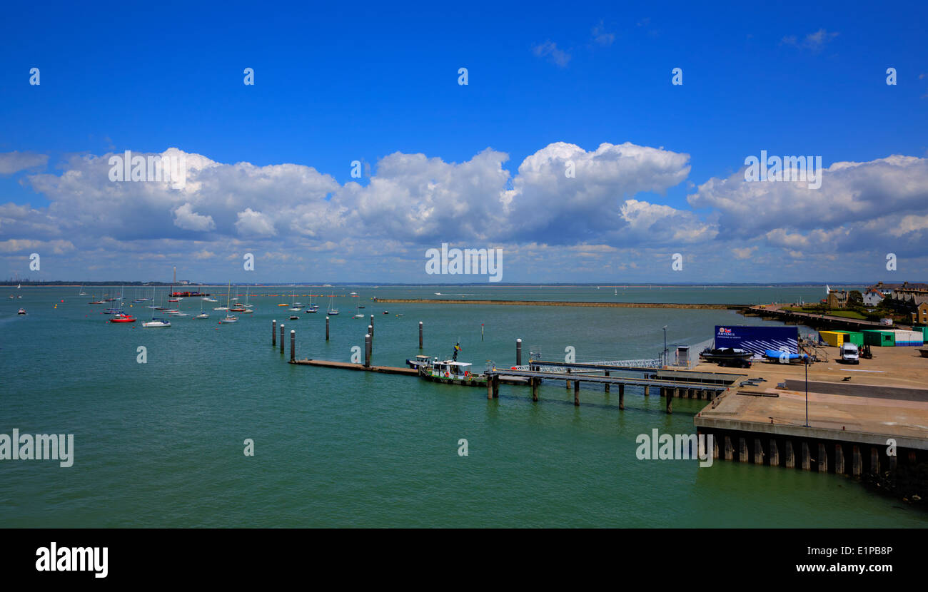 Cowes harbour Isle of Wight with jetty boats and blue sky and clouds Stock Photo