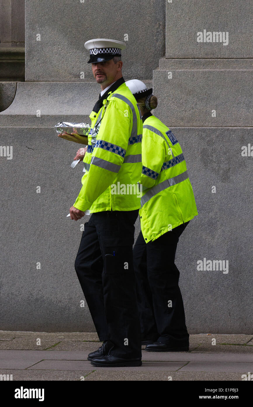 Liverpool, Merseyside, UK 8th June, 2014. Policing on Water Street as Filming for BBC1 drama Oakfield continues - to be told in a new BBC1 family drama set to air next year. The scripts are written by Matt Charman and it will be directed by Andy de Emmony who worked on The Bletchley Circle . The drama, being filmed on location in Liverpool and Walton Hall Park in Warrington by production company Big Talk. Stock Photo