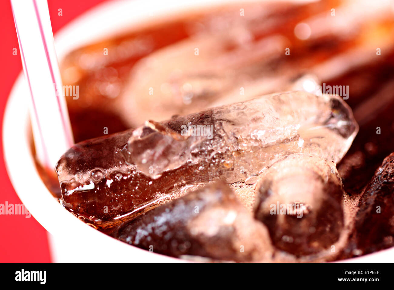 Macro Ice in a glass of Coca-Cola for foods background. Stock Photo