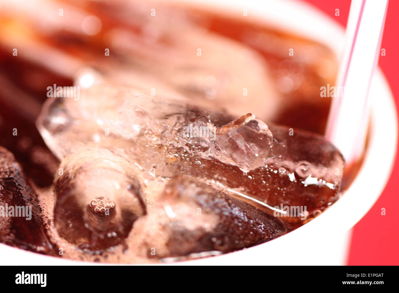 Macro Ice in a glass of Coca-Cola for foods background. Stock Photo