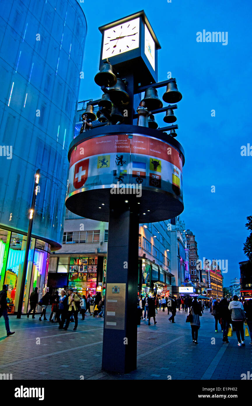 Leicester Square at night showing the Swiss Glockenspiel , West End