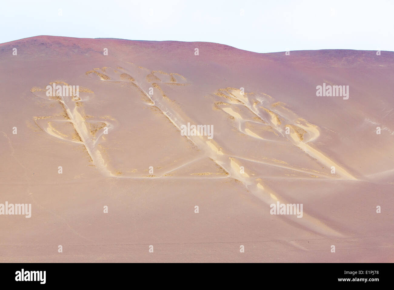 Candelabra, Peru, ancient mysterious drawing in the desert sand, Paracas National Park Stock Photo