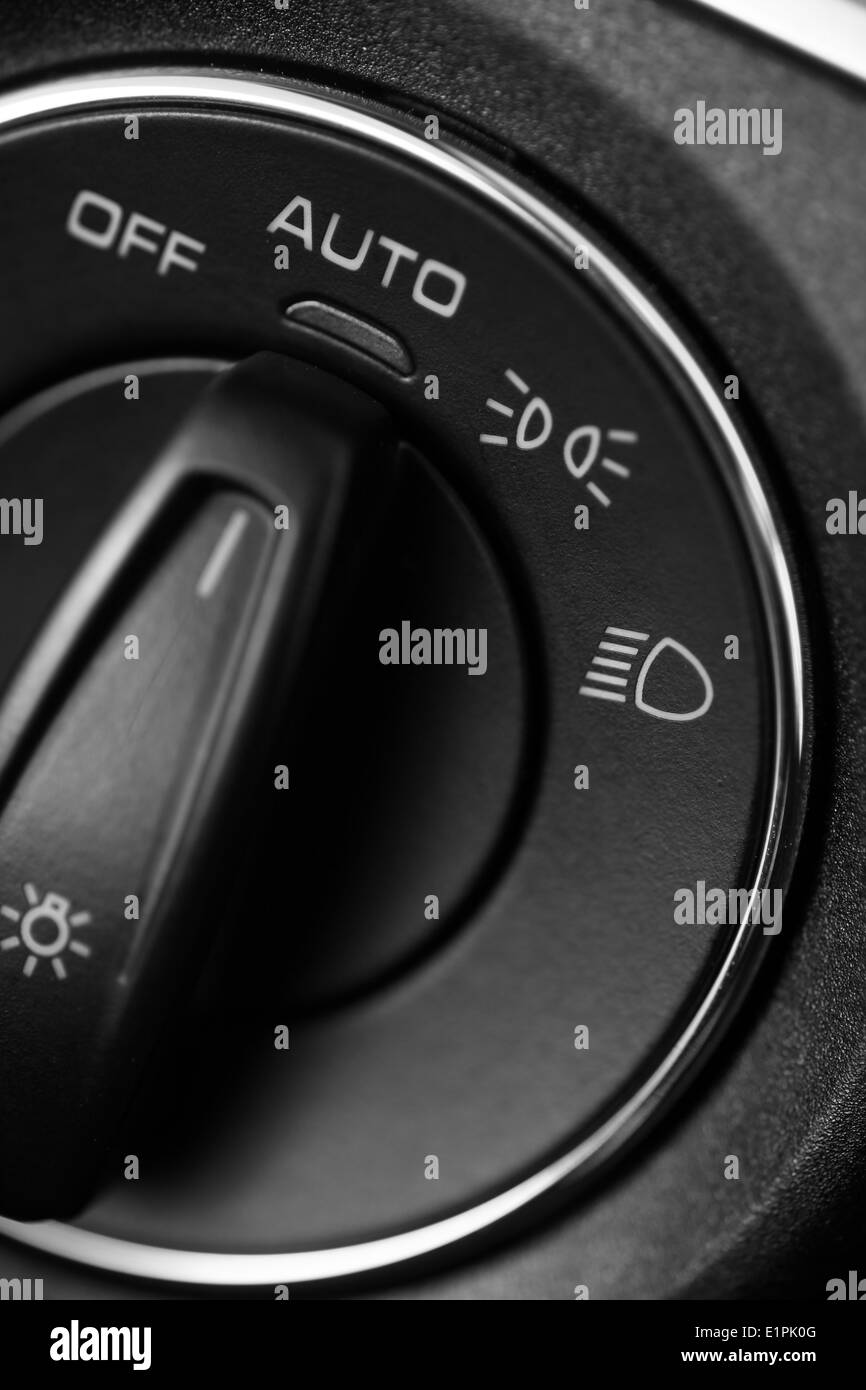 Detail of the headlight button in a car Stock Photo - Alamy