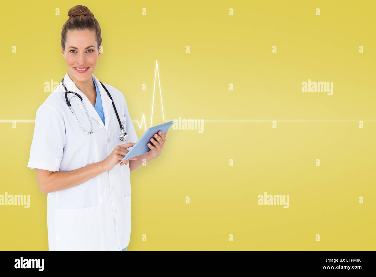 Composite image of pretty nurse using tablet pc Stock Photo